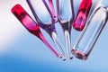 Medical ampoules on red and blue Royalty Free Stock Photo