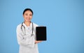 Medical App. Asian Female Doctor Showing Digital Tablet With Blank Blank Screen Royalty Free Stock Photo