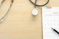 Medical appointment book in the calendar stethoscope and calendar schedule to check up Royalty Free Stock Photo