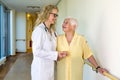 Medical Assistant Assisting Elderly in Hospital Royalty Free Stock Photo