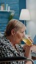 Medical assistant giving glass with effervescent vitamin to patient