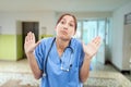 Medical assistant making not guilty gesture Royalty Free Stock Photo