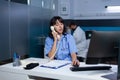 Medical assistant talking on landline phone for healthcare Royalty Free Stock Photo