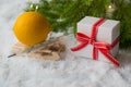 Medical bath, gift box, thermometer and Christmas tree on a snowy background. Copyspace. Medication. Catarrhal disease