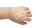 Medical big elastic plaster on woman hand isolated on the white background Royalty Free Stock Photo