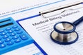 Medical bill and insurance form with calculator Royalty Free Stock Photo