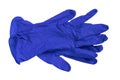 Medical blue latex gloves lie on a white background