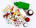 Medical bottles and foil blisters with the capsules and tablets Royalty Free Stock Photo