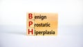 Medical and BPH, Benign Prostatic Hyperplasia symbol. Wooden blocks with the word `BPH`. Beautiful white background. Copy space. Royalty Free Stock Photo