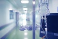 Medical building corridor with standing intravenous drip bag on Royalty Free Stock Photo