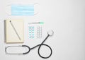 Medical cardiology equipment on a white background. Stethoscope, tablet,pills, thermometer, notebook, syringe. Medical concept, t