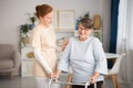 Medical caretaker helping senior woman