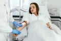 Medical Center. Doctor Scanning Woman Hand With Vein Finder