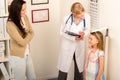 Medical check-up at pediatrist girl measure height Royalty Free Stock Photo