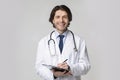Medical Check-Up. Portrait Of Friendly Young Doctor With Clipboard In Hands Royalty Free Stock Photo