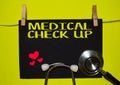 MEDICAL CHECK UP on top of yellow background