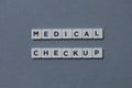 ' Medical Checkup ' word made of square letter word on grey background