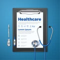 Medical clipboard and paper with and doctor stamp, stethoscope, syringe and injection ampule. Royalty Free Stock Photo