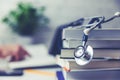 Medical college student with stack of books Royalty Free Stock Photo