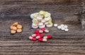Medical colorful pills on isolated on wooden background