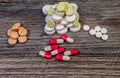 Medical colorful pills on isolated on wooden background