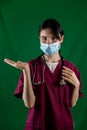 beautiful female doctor in white coat with stethoscope waist up. Royalty Free Stock Photo