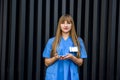 Medical concept. Beautiful young nurse in blue uniform holds pills Royalty Free Stock Photo