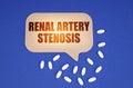 On the blue surface of the tablet and a cardboard plate with the inscription - Renal artery stenosis