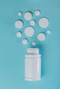 Medical concept - different shape white pills on blue background Royalty Free Stock Photo