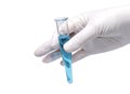 Medical concept: doctor`s hand in rubber glove holding test-tube with blue liquid Royalty Free Stock Photo