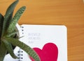 Medical concept, Flatley, world health day, text on Notepad, heart shape, on wooden table