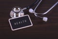 Medical Concept-Health words written on label tag with Stethoscope Royalty Free Stock Photo