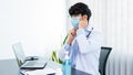 Medical concept a male doctor wearing mask and using hand sanitizer alcohol gel for preventing against infection of Coronavirus Royalty Free Stock Photo