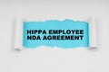 In the middle of a white sheet in space on a blue background the inscription - HIPPA Employee NDA agreement