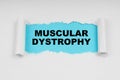 In the middle of a white sheet in space on a blue background the inscription - MUSCULAR DYSTROPHY