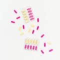 Medical concept with pills of vitamins on white background. Flat lay Royalty Free Stock Photo