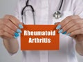 Medical concept about Rheumatoid Arthritis RA with inscription on the page