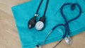 Medical Concept. Top view of stethoscope, clipboard, pen and eye glasses on blue background. Flat lay and copy space Royalty Free Stock Photo