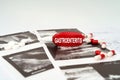 On the ultrasound pictures there are pills and a pen with the inscription - Gastroenteritis