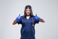 Medical concept of young beautiful female doctor with protective face mask, waist up. Woman hospital worker looking at camera and Royalty Free Stock Photo