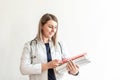 Medical conceptual, hospital or clinic medical service. young intern nurse holding a clipboard