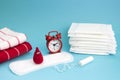 Medical conceptual photo. Red dreamy smile crochet blood drop, daily and menstrual pad and tampon. Woman critical days, gynecologi