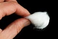 Medical cotton wool in hand Royalty Free Stock Photo