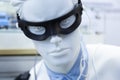 Medical device in form of black glasses on the head of a male mannequin made of white plastic, wires and electrodes Royalty Free Stock Photo