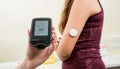 Medical device for glucose check. Continuous glucose monitoring pod. Royalty Free Stock Photo