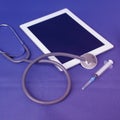 Medical device for listening stethoscope, tablet, syringe for injection, medical research and healthcare concept, top view, close-