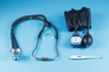 Medical devices stethoscope, tonometer, and thermometer Royalty Free Stock Photo