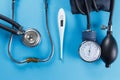 Medical devices stethoscope, tonometer, and thermometer Royalty Free Stock Photo