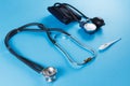 Medical devices stethoscope, tonometer, and thermometer Royalty Free Stock Photo