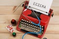 medical diagnosis - doctor workplace with blue stethoscope, pills, red typewriter with text Eczema Royalty Free Stock Photo